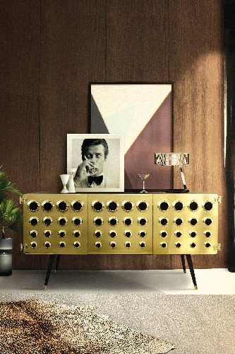 If you're looking for a mid century modern style, you can opt for a golden sideboard. Monocles by DelightFULL is 100% prepared for Martini and Gin bottles and it's made in solid walnut wood and brass with knurled details.