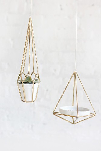 Add some brass details to your living room design plant vases