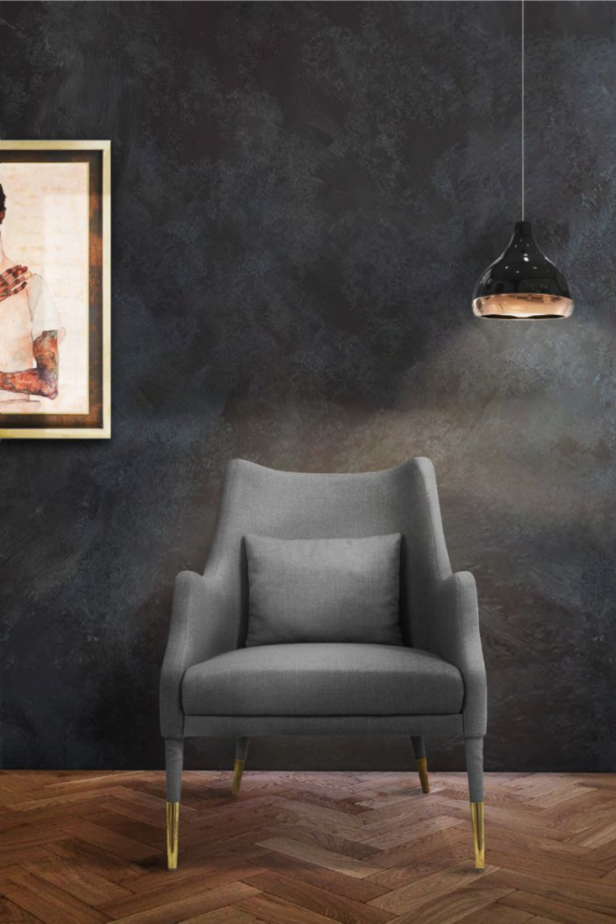 The combination of exotic material such as dark walnut wood and gold